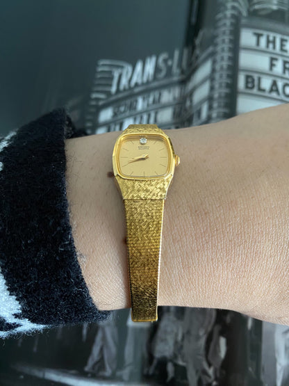 Vintage 1980s Ladies Seiko Gold Tone Watch with a Diamond Accent